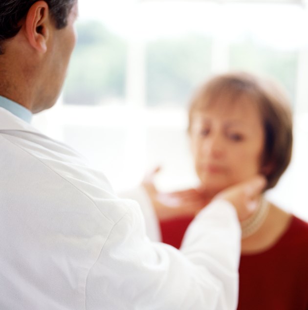 black and white portrait of a doctor checking a patients throat glands