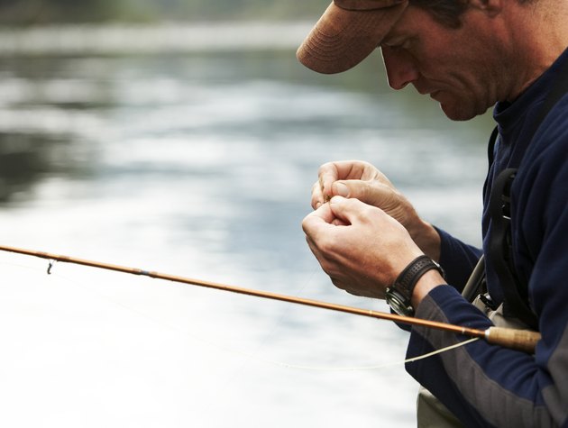 Fly fisherman tying lures