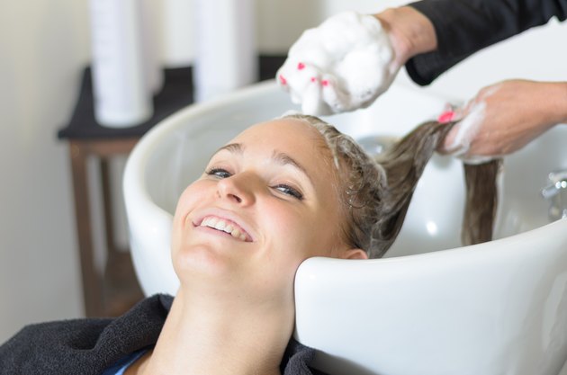 Woman having her hair shampooed
