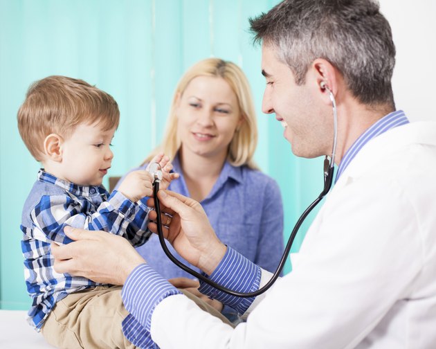 Pediatrician checking baby patient.