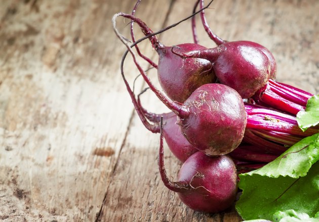 Bunch of fresh organic beets with tops