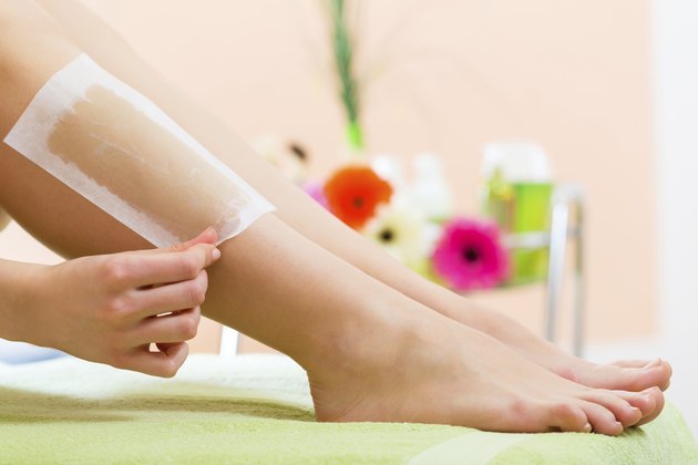 Woman in Spa getting leg waxed