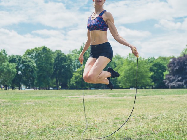 Woman skipping in the park
