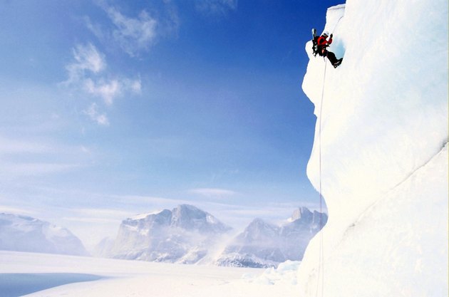 Low angle view of a person climbing a mountain