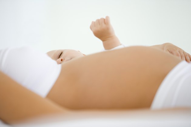 Pregnant woman with sleeping baby