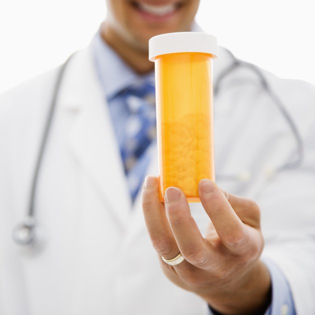 Hand with pill bottle
