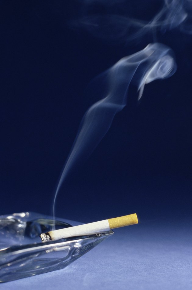 Cigarette burning in an ashtray