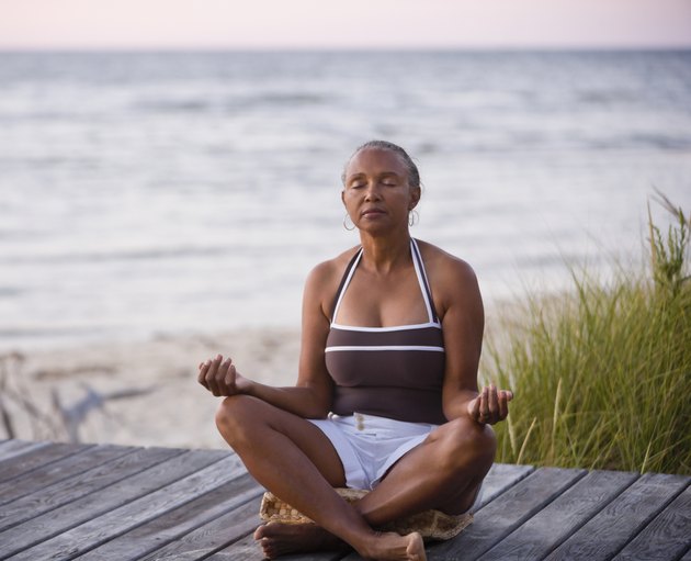 Senior African American woman meditating