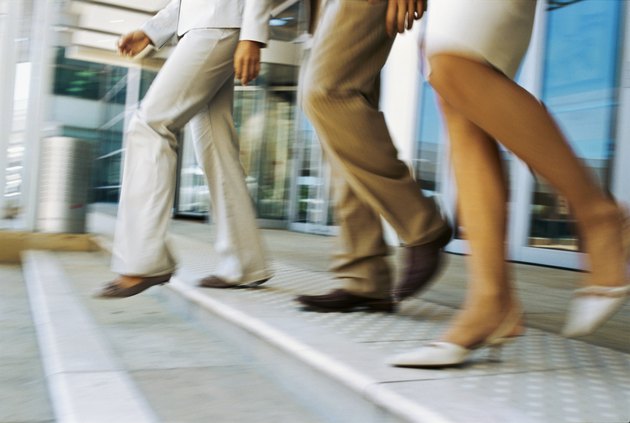 low section view of men and women walking