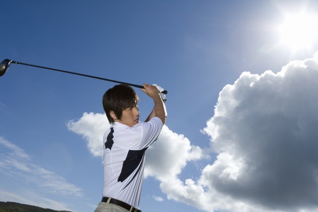 Man playing shot under the blue sky, lens flare, Saipan, USA
