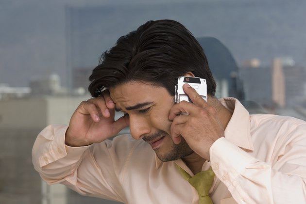 Hispanic businessman talking on cell phone