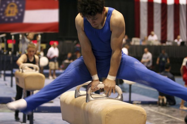 Boy competing on pommel