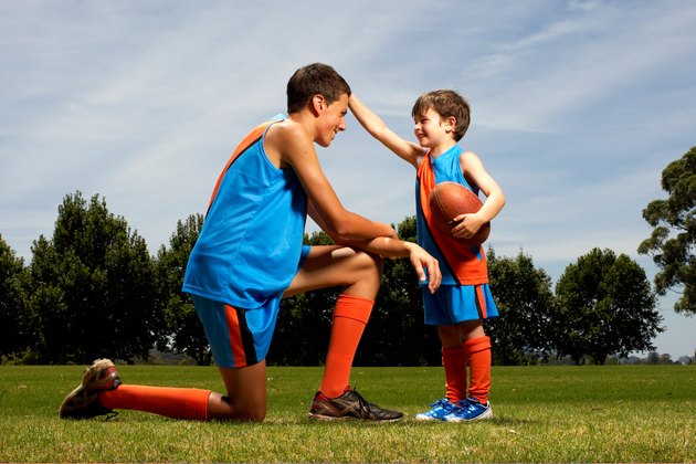 Young boy facing older boy