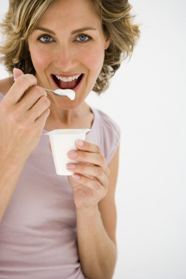 Woman eating yogurt