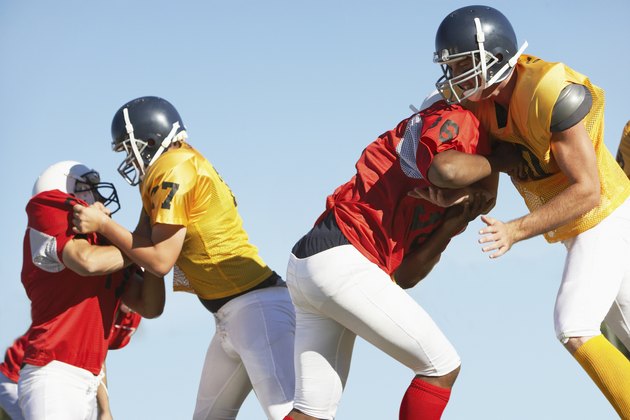 Football Players Tackling