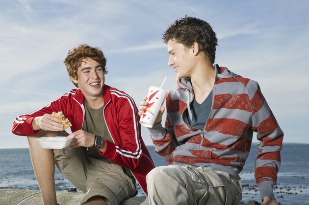 Teenage boys with fast food