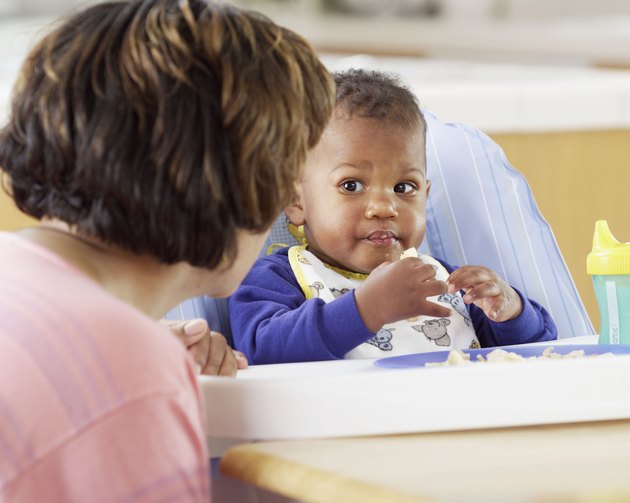 Baby eating in high chair