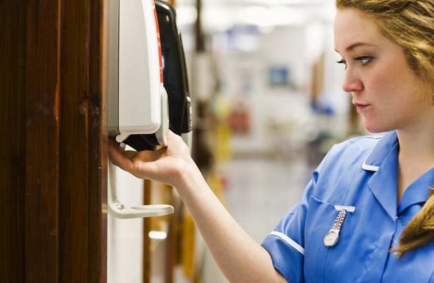 Nurse using hand sanitizer