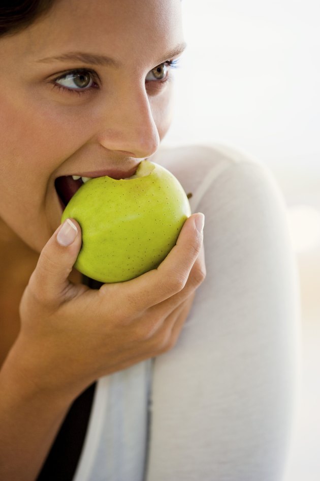 Woman eating apple