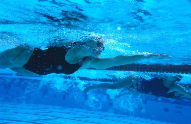 underwater shot of a young female swimmer swimming the freestyle stroke