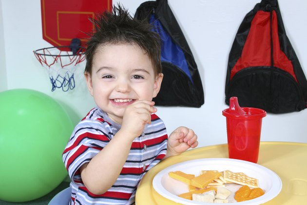 Adorable Preschooler Eating Snacks