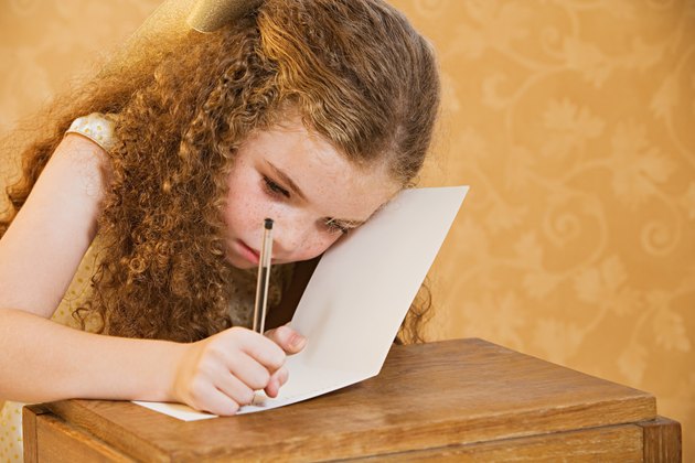 Girl writing a greetings card