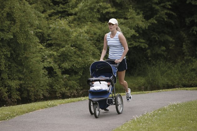 Woman jogging with baby in stroller