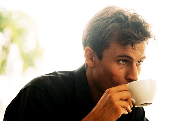Young man drinking a cup of coffee