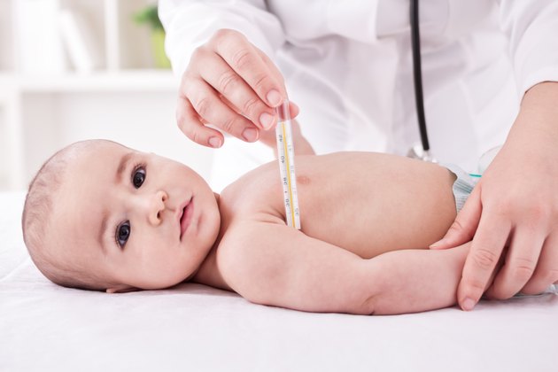 Fever, measuring temperature for little boy