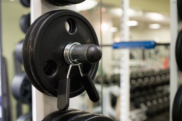 Weights on an exercise machine in gym, close up, differential focus