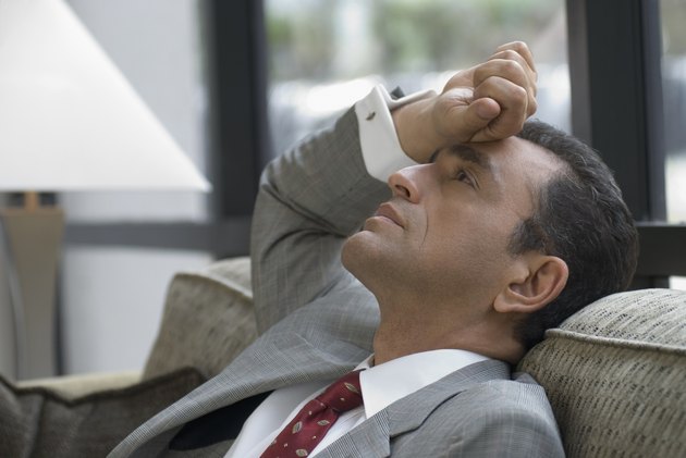 Hispanic businessman on sofa