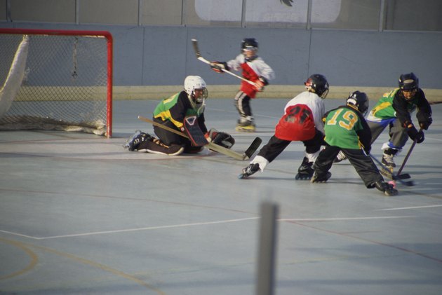 Boys playing rollerhockey
