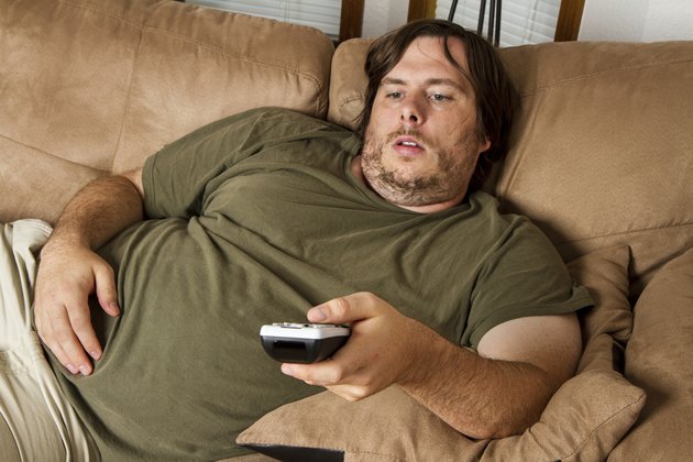 Fat lazy guy on the couch