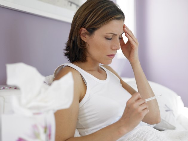 Woman taking temperature