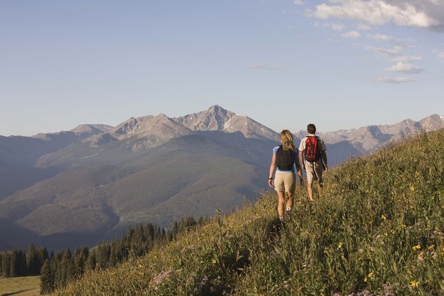 People hiking on mountainside