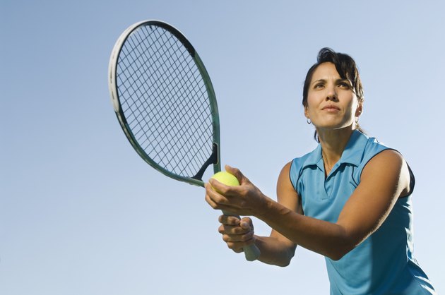 Tennis player serving