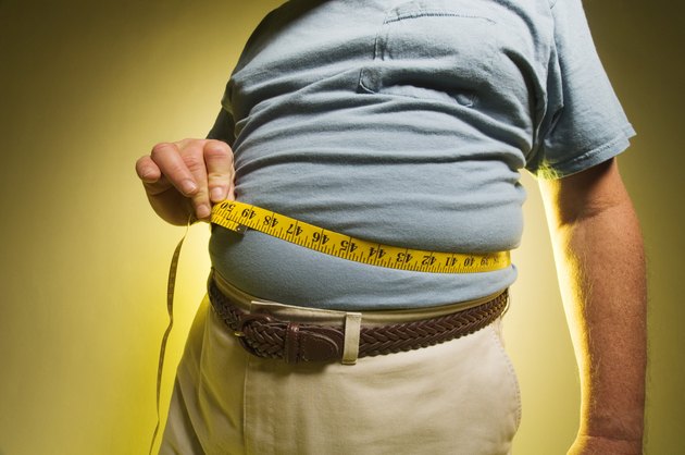Man measuring his waist