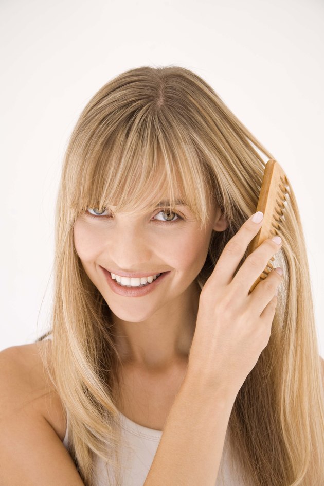 Woman combing hair