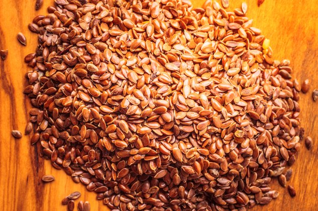 Heap of flax seeds linseed closeup
