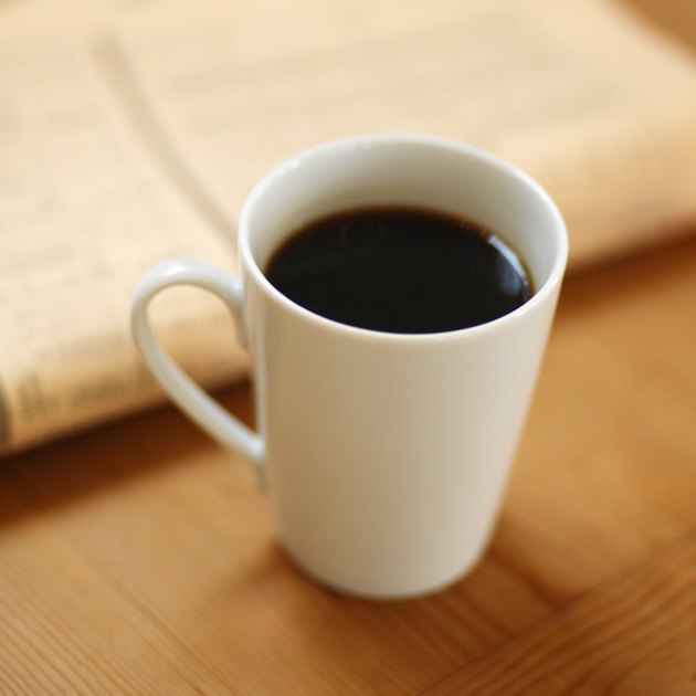 elevated view of a mug of black coffee