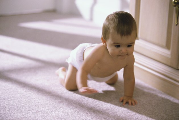 Baby boy crawling on the floor