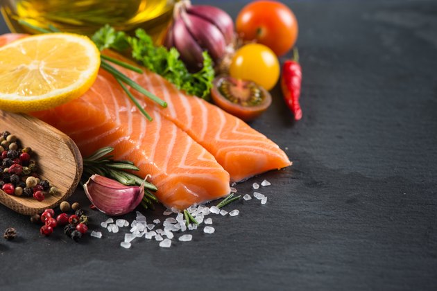Portion of fresh salmon with spices,herbs and vegetables