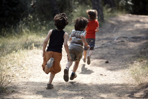 boys running on trail