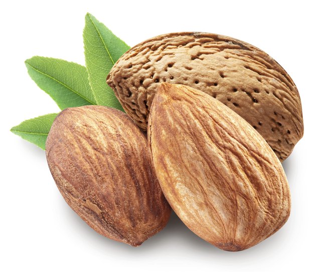 Almonds with leaves isolated.