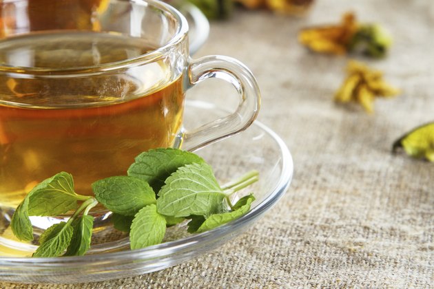 Tea cup with fresh mint leaves