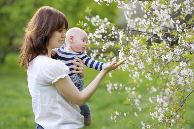 Little baby with her mother in the garden