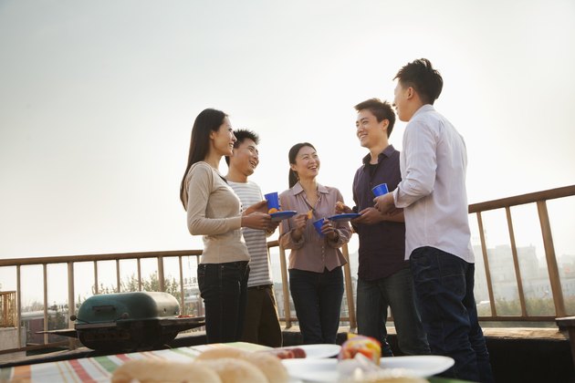 Group of Friends Having a Barbeque on a Rooftop