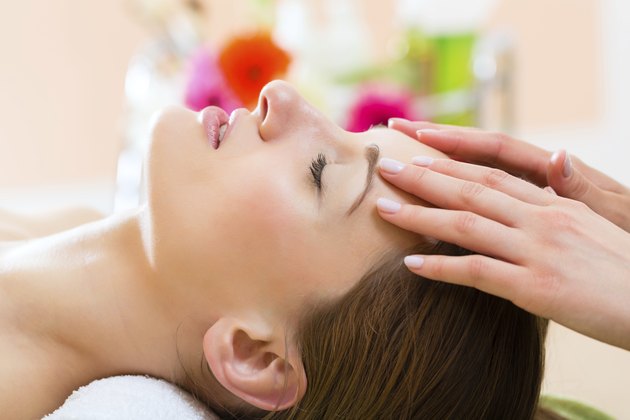 Wellness - woman getting head massage in Spa