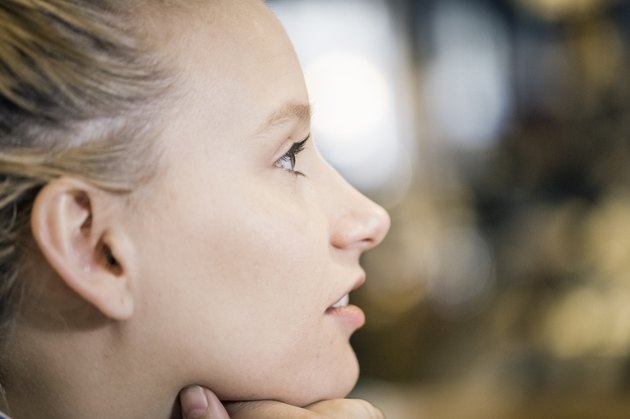 Close-up of thoughtful young woman in cafe