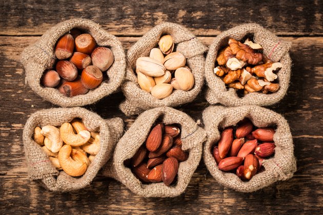Mix nuts on wooden table,healthy vegan food.